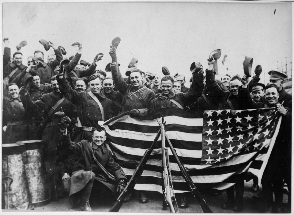 American troops in Russian port about to leave that country. They are here cheering and displaying the stars and stripes - NARA - 533737