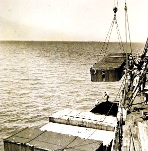American tanks, automobiles, and trucks being loaded into a barge, Middle East, 1942 (24997649495)