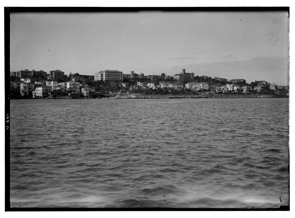 American University. Beirut, (A.U.B.). The campus from the sea. Showing left to right- The medical, the museum (Post Hall), the chapel, College Hall and chemistry bldg's LOC matpc.02833