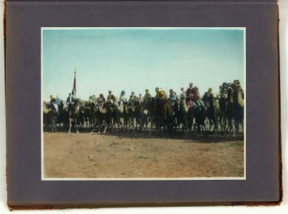 Amir Abdullah's bodyguard on camels with red, green and white standard at far left LCCN2008676390