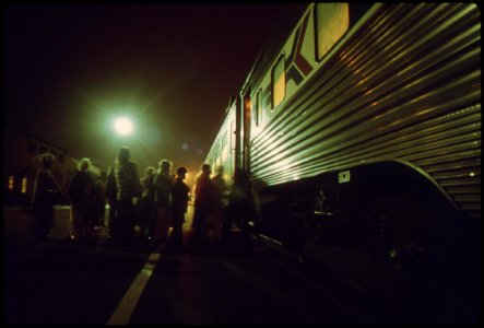 Amtrak-passengers-board-the-southbound-san-diegan-as-it-makes-a-nighttime-stop-at-the-fullerton-california-station-may-1974 7158144646 o