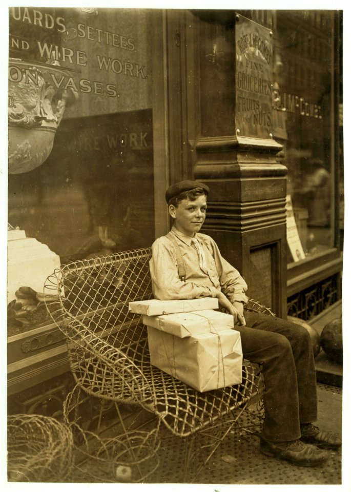 An Enforced Rest. Harry Swope, aged 15, 426 Elm St., Newport, Ky., Carrying heavy bundles of paper for a News & Sta'y Co. LOC cph.3b23467