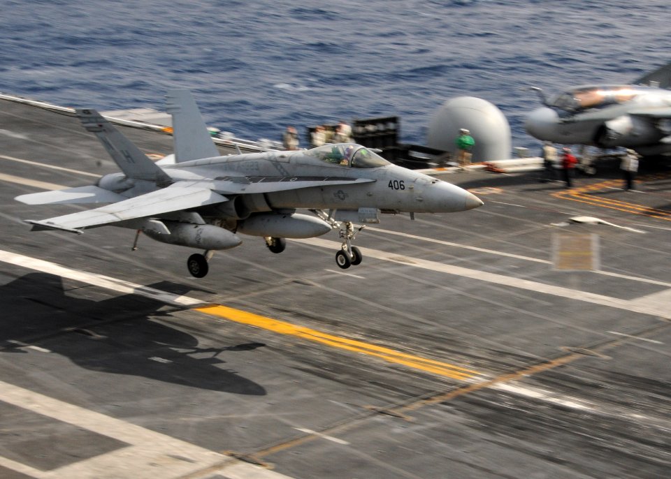 An F A-18C lands aboard USS Nimitz at sea. (8637770704)