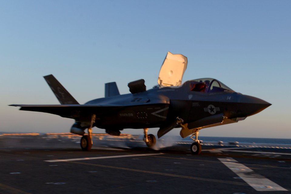 An F-35B aircraft takes off from the flight deck of USS Essex