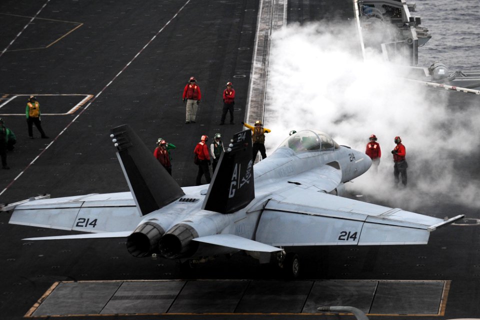 An F-A-18F is directed to a catapult at sea. (8576450595)