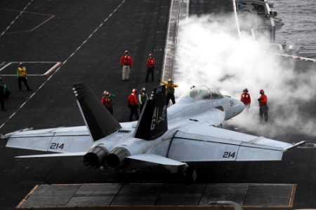 An F-A-18F is directed to a catapult at sea. (8576450595)