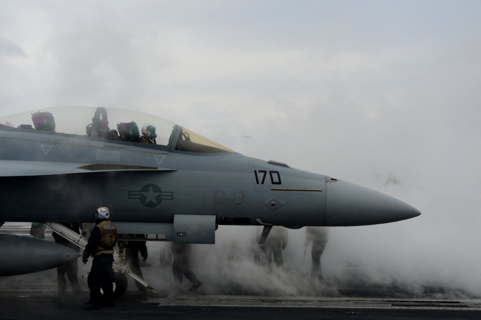 An F-A-18F prepares to launch at sea. (8426061881)