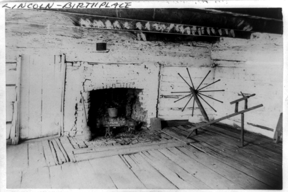An Interior view of the original Lincoln cabin showing the old fireplace in the west room and the old spinning jenny of Mrs. Lincoln LCCN89716181