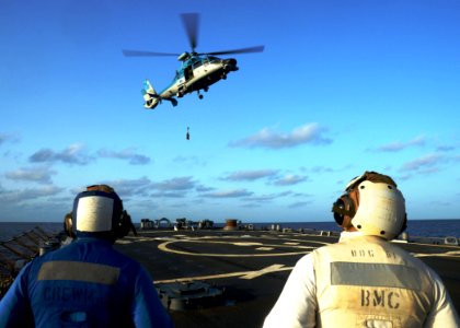 An Israeli navy AS565 Panther helicopter assigned to the Israeli navy corvette INS Eilat (501) conducts a vertical replenishment with the guided missile destroyer USS Ramage (DDG 61) in the Mediterranean Sea 140409-N-CH661-131