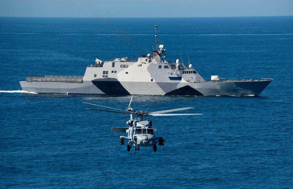 An MH-60R flies near USS Freedom. (8509275359)