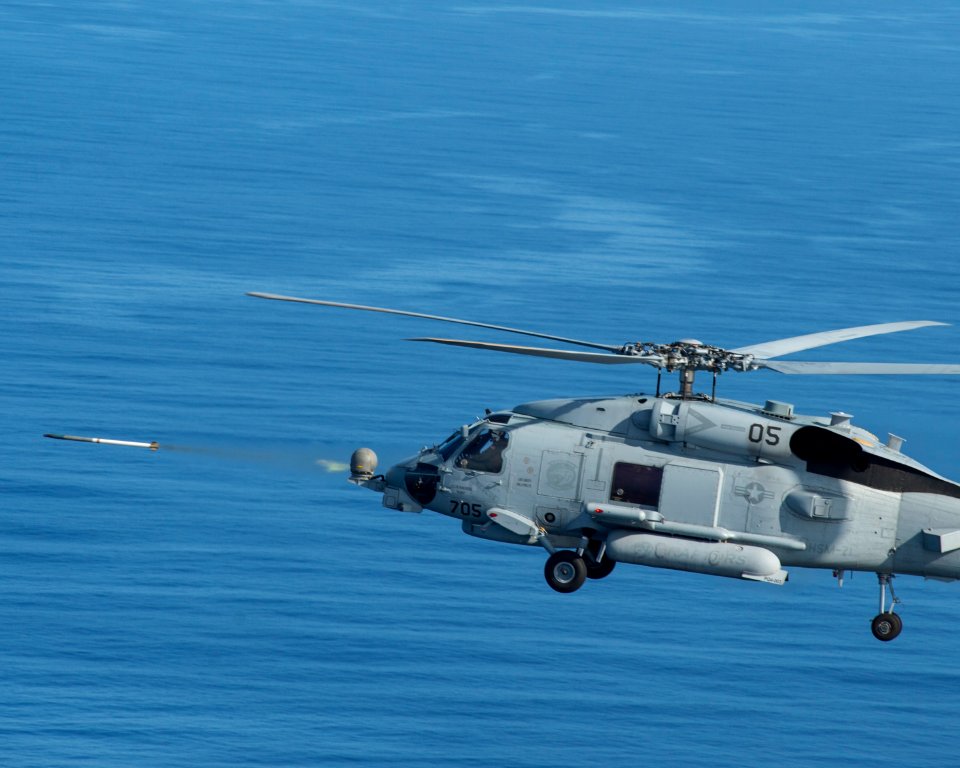 An MH-60R Sea Hawk helicopter fires inert rockets during a training exercise. (22032501139)