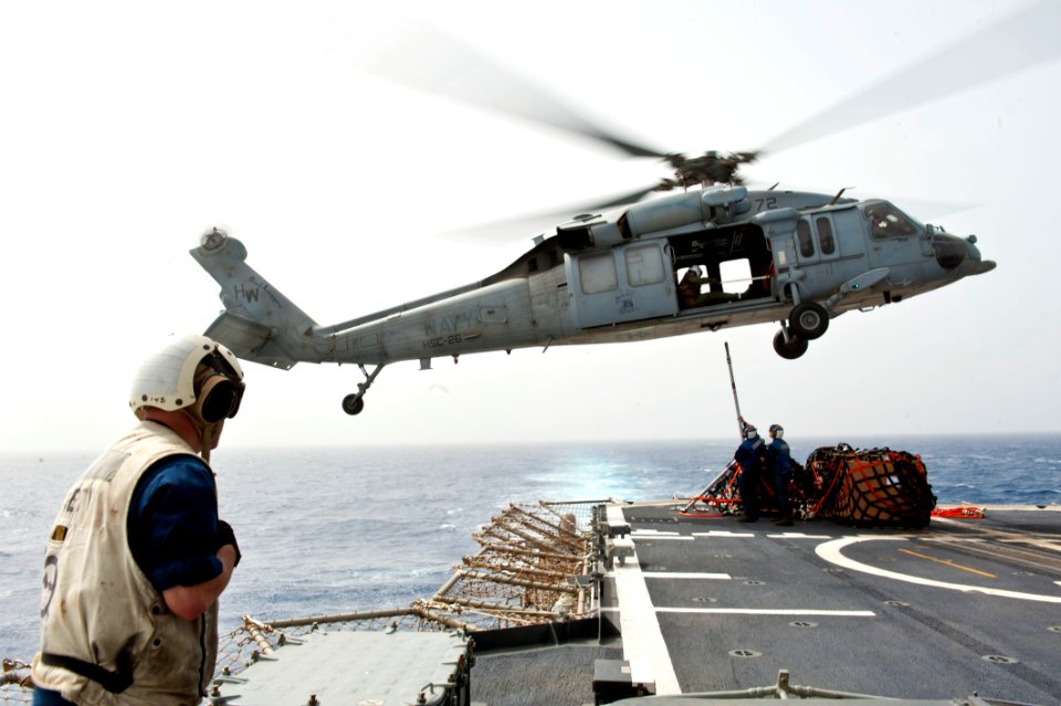 An MH-60S drops cargo aboard USS Hue City. (8570978719)