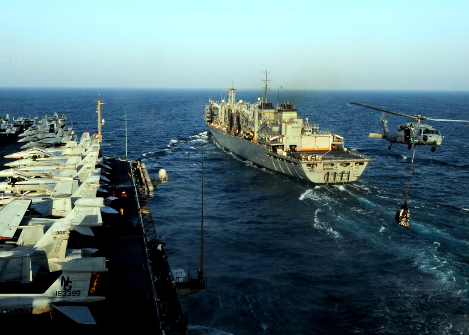 An MH-60S carries cargo during a replenishment-at-sea. (8591438957)
