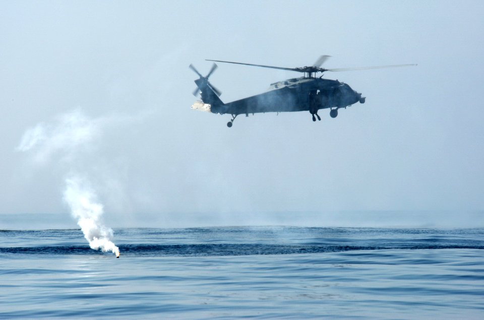 An MH-60S circles a flare during an exercise. (8190912564)