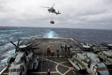 An MH-60S delivers cargo to USS San Antonio. (8498330258)