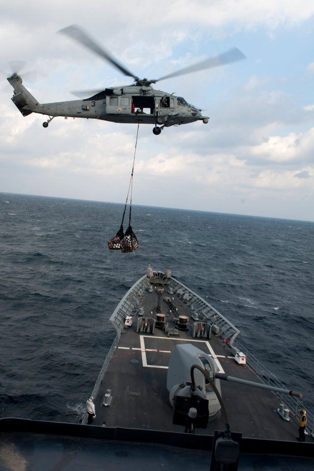 An MH-60S delivers supplies to USS Mobile Bay. (8232063883)