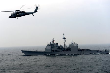 An MH-60S flies over USS Mobile Bay. (8430023352)