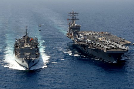 An MH-60S moves cargo to USS Dwight D. Eisenhower. (8591439725)