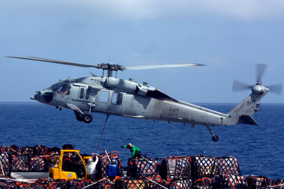 An MH-60S Sea Hawk helicopter picks up supplies. (8722867783)