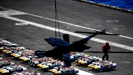 An MH-60S Sea Hawk helicopter transports ordnance from USS Theodore Roosevelt. (41670072651)
