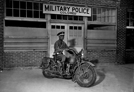 An MP on motorcycle stands ready to answer all calls around his area. Columbus, Georgia - NARA - 531136restoredh photo