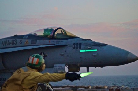 An officer directs an F-A-18C to launch. (8200228866)