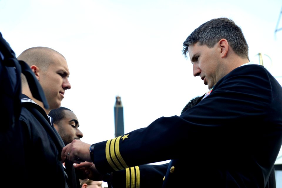 An officer conducts a uniform inspection at sea. (8498330334)