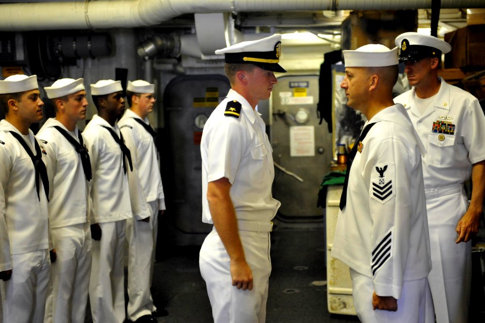 An officer conducts a uniform inspection at sea. (8498338820)