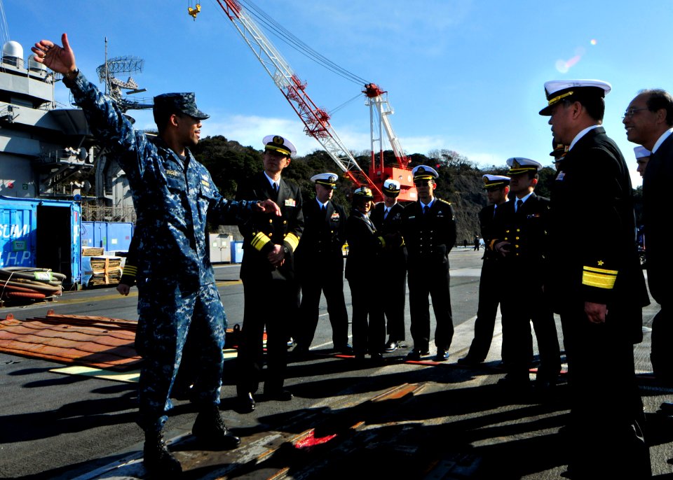 An officer gives a tour of USS George Washington. (8426065473)
