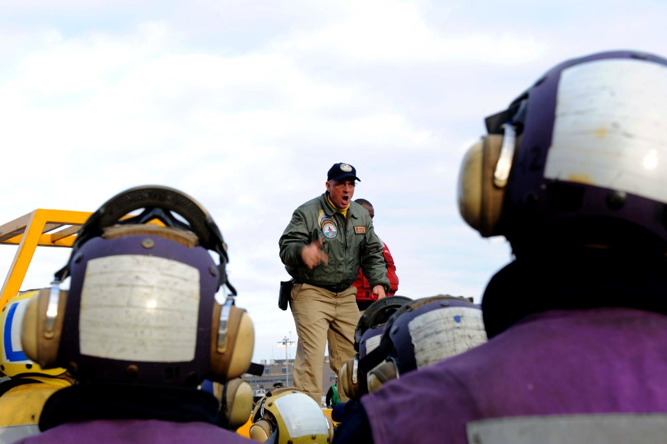 An officer speaks aboard USS George H.W. Bush. (8247725266)