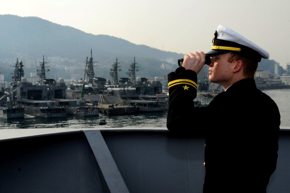 An officer stands watch as USS Blue Ridge enters port. (8570977019)