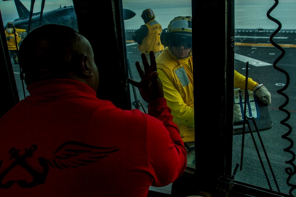 An Officer signals weight values to a Sailor. (8199139911)