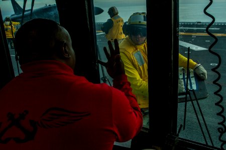 An Officer signals weight values to a Sailor. (8199139911)