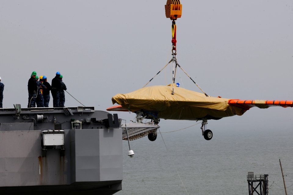 An X-47B is loaded onto flight deck of USS George H.W. Bush. (8720065823)