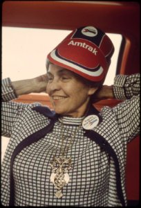 An-amtrak-eyeshade-and-a-tracks-are-back-pin-are-worn-by-a-passenger-on-the-southwest-limited-train-enroute-between-albuquerque-new-mexico-and-dodge-city-kansas-june-1974 7158201288 o photo