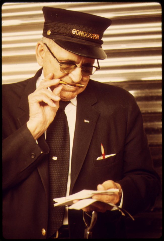 An-amtrak-conductor-for-the-coast-starlight-which-travels-between-los-angeles-california-and-seattle-washington-may-1974 7158153088 o
