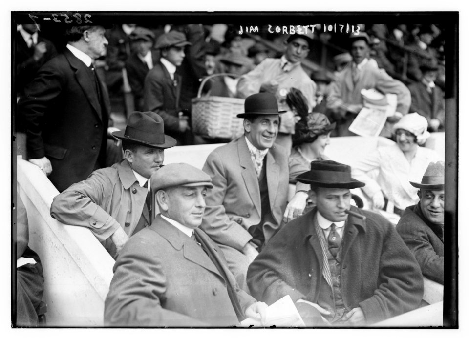 Boxer Jim Corbett (center) and Blossom Seeley (wife of Rube Marquard) to Corbett's left at Game One of the 1913 World Series at the Polo Grounds New York (baseball) LCCN2014694431