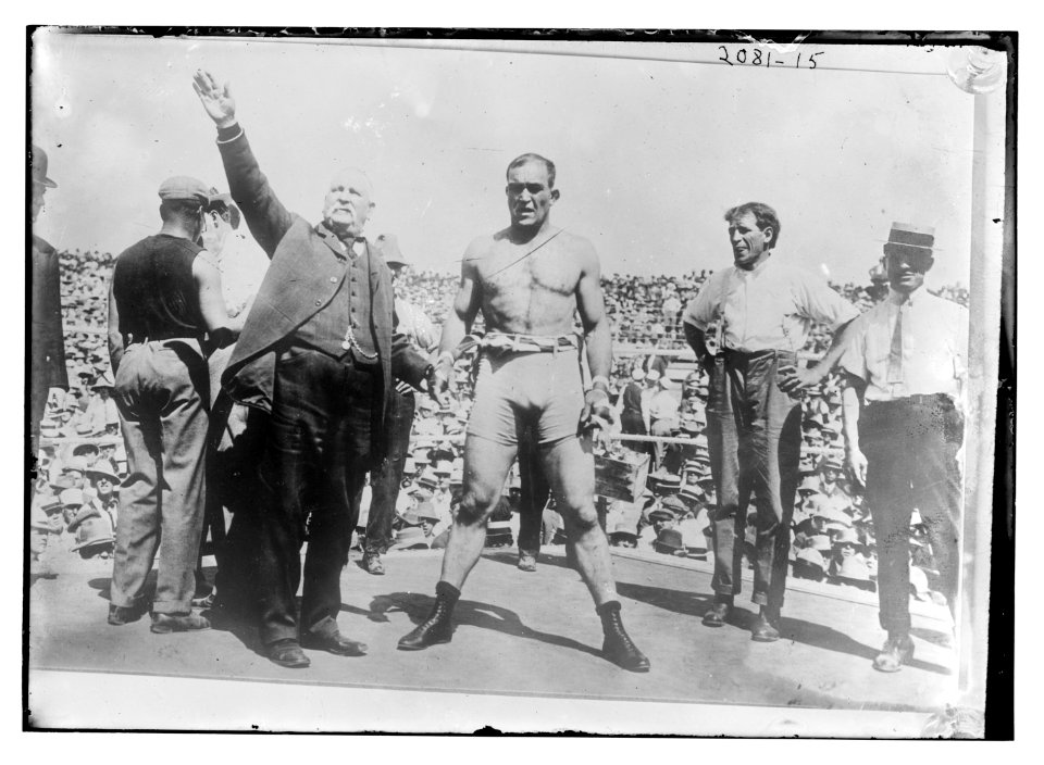 Boxer and announcer in boxing ring LCCN2014688556