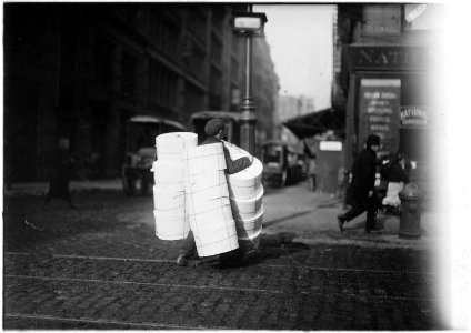 Boy carrying hats. New York City. - NARA - 523519 photo