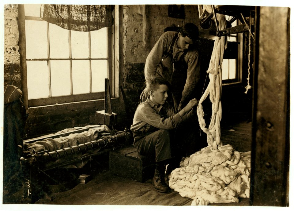 Boy at warping machine. Been there 2 years. Clyde Cotton Mill. LOC nclc.05391