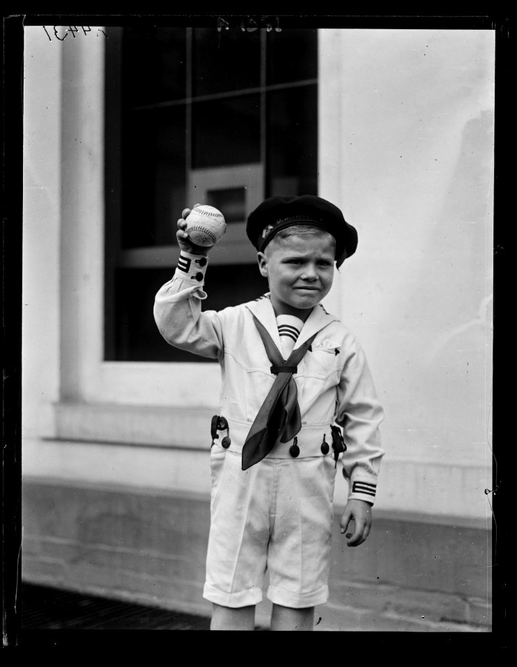 Boy in sailor suit with baseball at White House, Washington, D.C. LCCN2016891417