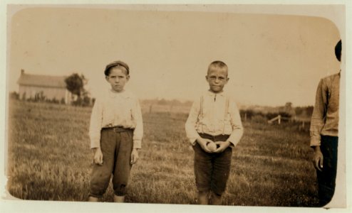 Boy on left is Arthur Pugh. Said he made bands (25 cents a day) in Starkville, (Miss.) Cotton Mill. Boy on right worked some time ago. LOC nclc.02040