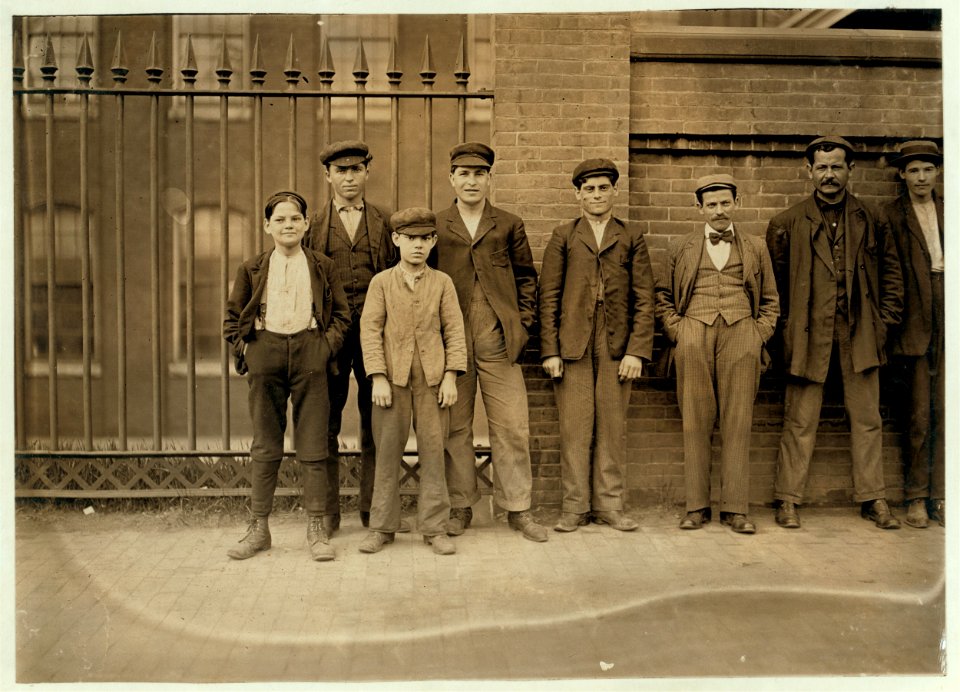 Boy on left hand end (hands in pockets) is Peter Carlos, 33 Waldron St. Been working in Mill No. 1 for 1 1-2 years. Smallest boy is Nicholas Karambles, 33 Waldron Street. Cocheco Mfg. Co., LOC nclc.01770