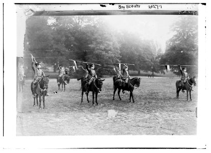 Boy Scouts. On Horseback with spears held aloft. LCCN2014688145
