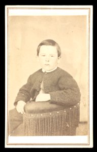 Boy sitting in chair) - James G. Stacy, Foxcroft, Maine LCCN2016653189