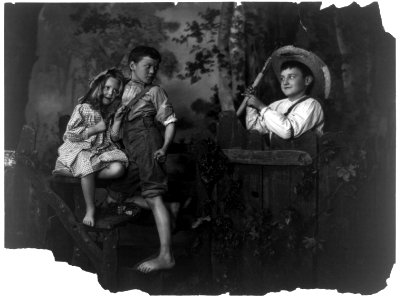 Boy teasing another boy, who has arm around girl LCCN2003675185