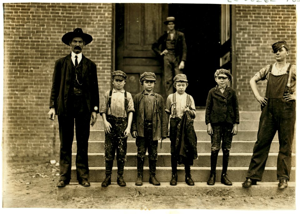Boy with coat in hand is 11 years old. Been there 9 months. Started at 50 cents a day. Now gets 60 cents. Loray Mill. 'When I sweeps double space I gets 90 cents a day, but it makes you LOC cph.3a48536