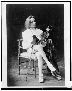 Boy, seated, full-length, facing right, holding violin and bow) - C.A. Scherer, N.Y LCCN95502766