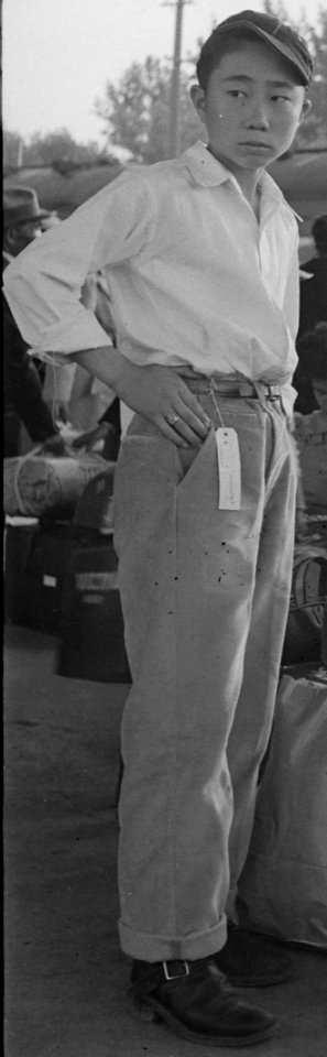 Boy with tag detail, Woodland, California. Families of Japanese ancestry with their baggage at railroad station awaiting . . . - NARA - 537804 (cropped)