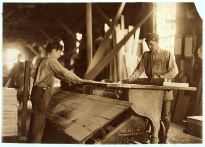 Boy working at double circular saws. N.Y. Dimension Supply Co.,. LOC cph.3a20818